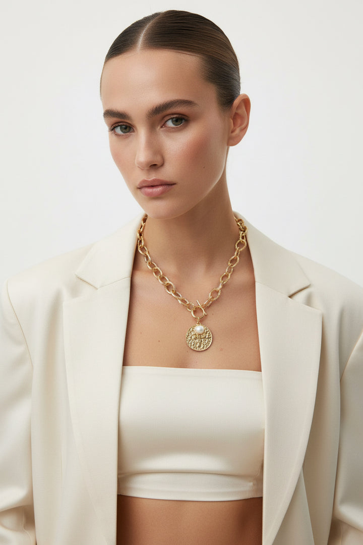 GOLD HAMMERED COIN TOGGLE NECKLACE