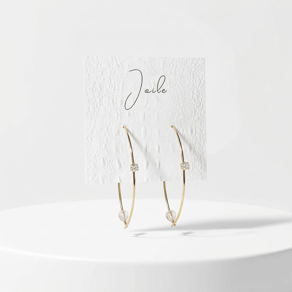 ABSTRACT LEAF SHAPED EARRINGS WITH SINGULAR STONE