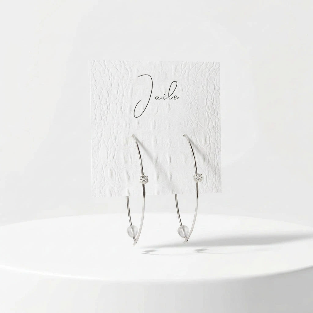 ABSTRACT LEAF SHAPED EARRINGS WITH SINGULAR STONE