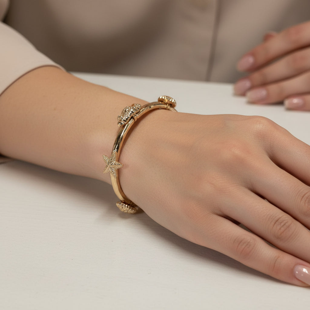 GOLD HAMMERED STRETCH BRACELET WITH SHELL ACCENTS