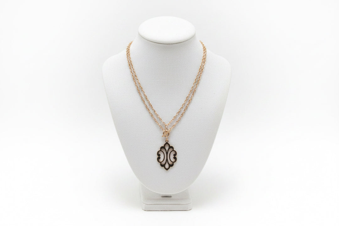 GOLD STACKED NECKLACE WITH ORNATE PENDANT