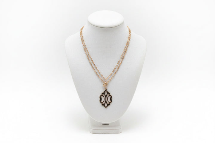 GOLD STACKED NECKLACE WITH ORNATE PENDANT
