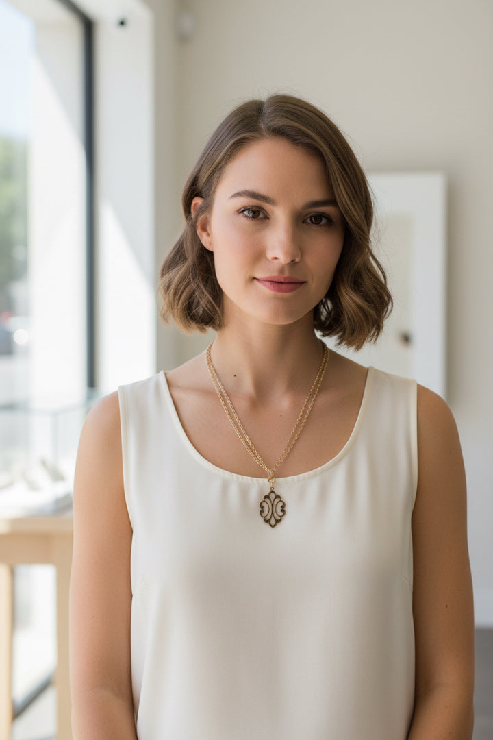 GOLD STACKED NECKLACE WITH ORNATE PENDANT